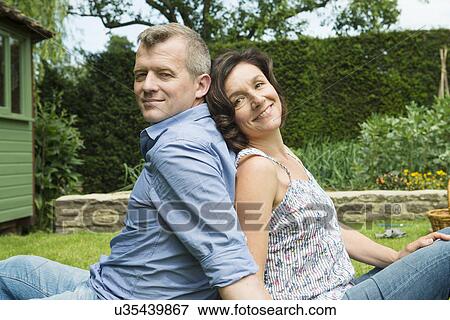 Portrait of mature couple back to back View Large Photo Image Stock Photo - Portrait of mature couple back to back. Fotosearch