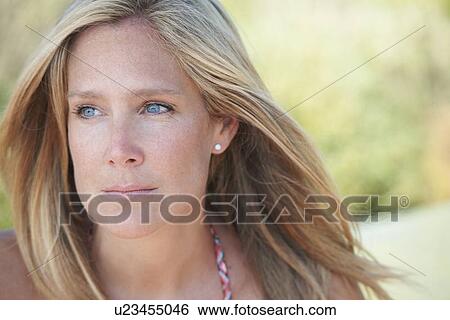 Portrait of mature woman with blonde hair, looking away View Large Photo Image Stock Photograph - Portrait of mature woman with blonde hair, looking away. Fotosearch