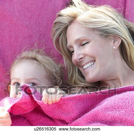 Portrait of mother and daughter wrapped in pink towel View Large Photo Image Stock Photography - Portrait of mother and daughter wrapped in pink towel. Fotosearch