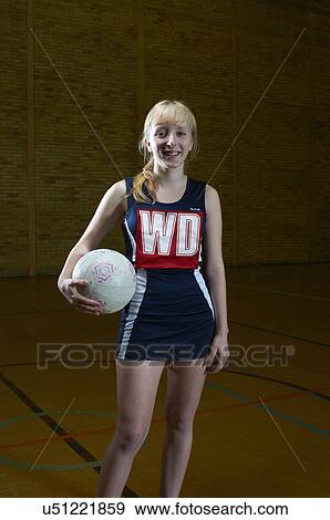 Portrait of netball player holding ball View Large Photo Image Stock Photo - Portrait of netball player holding ball. Fotosearch