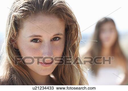 Stock Image - Portrait of teenage girl, focus on foreground. Fotosearch