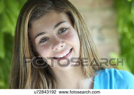 Portrait of teenage girl looking at camera, close up View Large Photo Image Stock Image - Portrait of teenage girl looking at camera, close up. Fotosearch