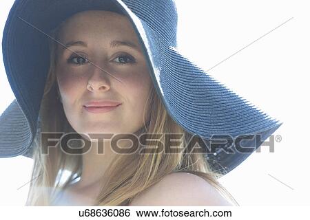 Portrait of teenage girl wearing blue sunhat View Large Photo Image Stock Photograph - Portrait of teenage girl wearing blue sunhat. Fotosearch