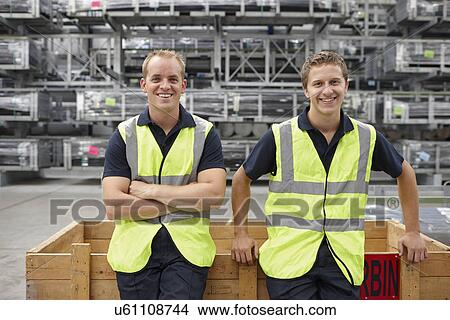 Picture - Portrait of warehouse workers in engineering warehouse. Fotosearch