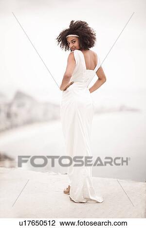 Portrait of woman wearing white dress, Alto Vidigal, Rio de Janeiro, Brazil View Large Photo Image Stock Image - Portrait of woman wearing white dress, Alto Vidigal, Rio de Janeiro, Brazil. Fotosearch