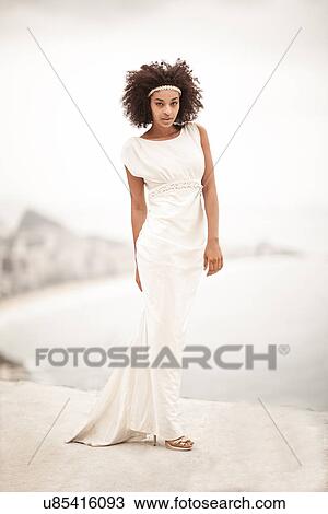 Portrait of woman wearing white dress, Alto Vidigal, Rio de Janeiro, Brazil View Large Photo Image Stock Image - Portrait of woman wearing white dress, Alto Vidigal, Rio de Janeiro, Brazil. Fotosearch