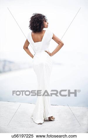 Portrait of woman wearing white dress, Alto Vidigal, Rio de Janeiro, Brazil View Large Photo Image Stock Photography - Portrait of woman wearing white dress, Alto Vidigal, Rio de Janeiro, Brazil. Fotosearch