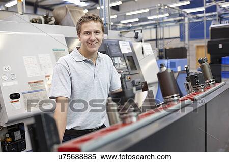 Portrait of worker in engineering factory View Large Photo Image Stock Photography - Portrait of worker in engineering factory. Fotosearch