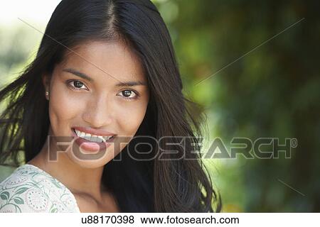 Portrait of young brunette woman smiling View Large Photo Image Stock Photo - Portrait of young brunette woman smiling. Fotosearch
