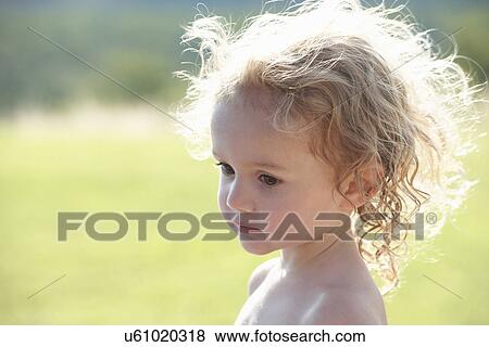 Stock Photo - Portrait of young girl looking away. Fotosearch