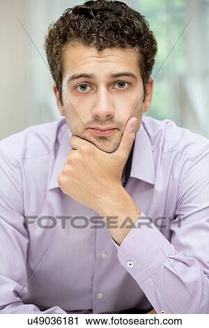 Stock Image - Portrait of young man. Fotosearch