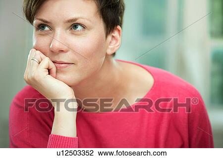 Stock Image - Portrait of young woman. Fotosearch