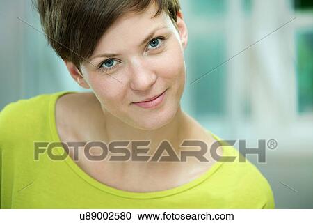 Stock Image - Portrait of young woman. Fotosearch
