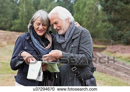 Senior couple looking at map View Large Photo Image Stock Image - Senior couple looking at map. Fotosearch