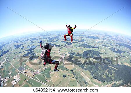 Skydivers having fun above Leutkirch, Bavaria, Germany View Large Photo Image Picture - Skydivers having fun above Leutkirch, Bavaria, Germany. Fotosearch