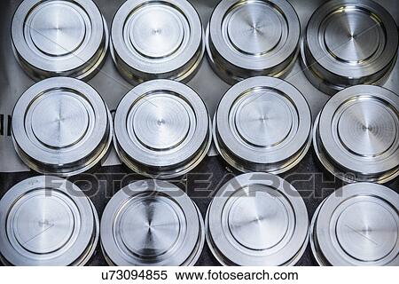 Stacks of raw and unworked steel discs in factory, overhead view View Large Photo Image Stock Photography - Stacks of raw and unworked steel discs in factory, overhead view. Fotosearch