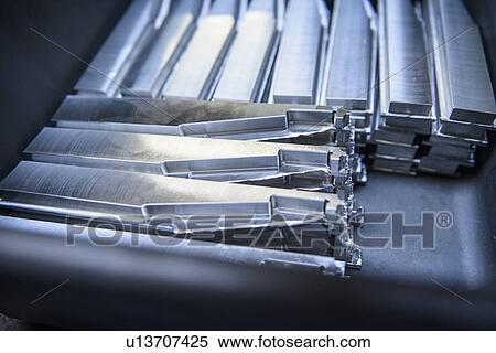 Stacks of unfinished engineering components in factory, close up View Large Photo Image Stock Photography - Stacks of unfinished engineering components in factory, close up. Fotosearch