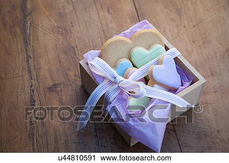 Still life with box of heart shaped cookies View Large Photo Image Stock Image - Still life with box of heart shaped cookies. Fotosearch