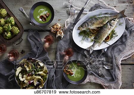 Still life with branzino fish and soup View Large Photo Image Stock Photo - Still life with branzino fish and soup. Fotosearch