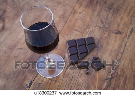 Stock Photo - Still life with dark chocolate and red wine. Fotosearch
