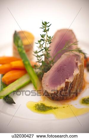 Still life with meat, asparagus and carrots View Large Photo Image Stock Photo - Still life with meat, asparagus and carrots. Fotosearch