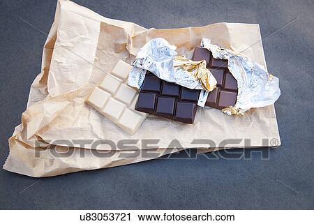 Still life with white, dark and milk chocolate View Large Photo Image Stock Image - Still life with white, dark and milk chocolate. Fotosearch