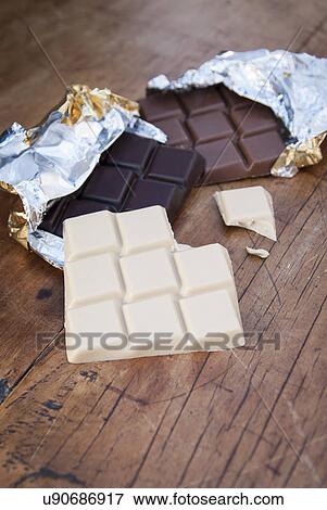 Still life with white, dark and milk chocolate View Large Photo Image Stock Photo - Still life with white, dark and milk chocolate. Fotosearch