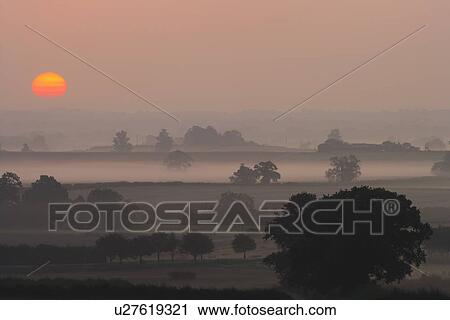 Sunset over rural scene, Shropshire, England, UK View Large Photo Image Stock Image - Sunset over rural scene, Shropshire, England, UK. Fotosearch