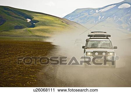 SUV driving through dusty landscape on the Icelandic highlands, Domadalur, Fjallabak, Iceland View Large Photo Image Stock Image - SUV driving through dusty landscape on the Icelandic highlands, Domadalur, Fjallabak, Iceland. Fotosearch