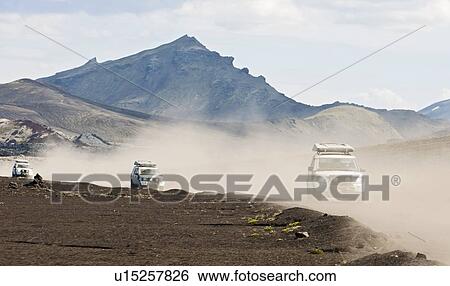 SUV driving through dusty landscape on the Icelandic highlands, Domadalur, Fjallabak, Iceland View Large Photo Image Stock Photograph - SUV driving through dusty landscape on the Icelandic highlands, Domadalur, Fjallabak, Iceland. Fotosearch