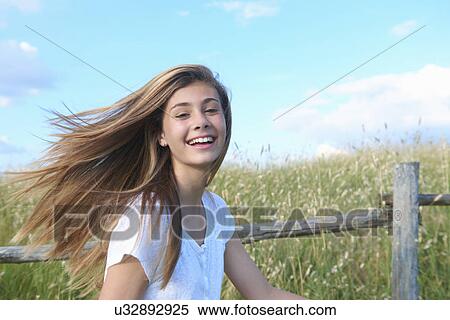 Teenage girl by wooden fence, Tuscany, Italy View Large Photo Image Stock Photography - Teenage girl by wooden fence, Tuscany, Italy. Fotosearch