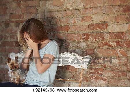 Teenage girl on bench with dog, crying View Large Photo Image Stock Photo - Teenage girl on bench with dog, crying. Fotosearch