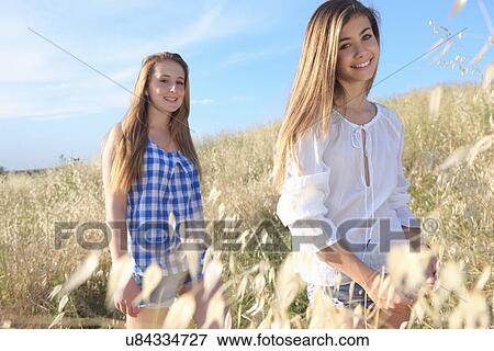 Teenage girls in field, Tuscany, Italy View Large Photo Image Stock Photo - Teenage girls in field, Tuscany, Italy. Fotosearch