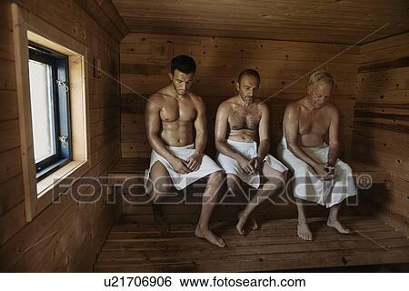 Three men sitting in sauna with heads bowed View Large Photo Image Stock Photograph - Three men sitting in sauna with heads bowed. Fotosearch