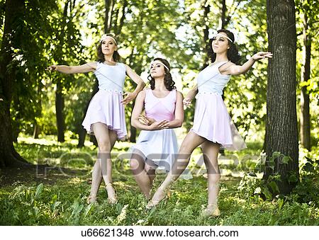 Three young ballet dancers performing in woods View Large Photo Image Stock Photo - Three young ballet dancers performing in woods. Fotosearch