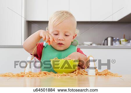Toddler playing with spaghetti View Large Photo Image Picture - Toddler playing with spaghetti. Fotosearch