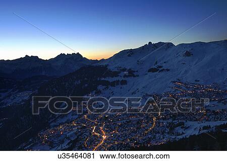 Stock Image - Town in mountains at night, Verbier, Switzerland. Fotosearch