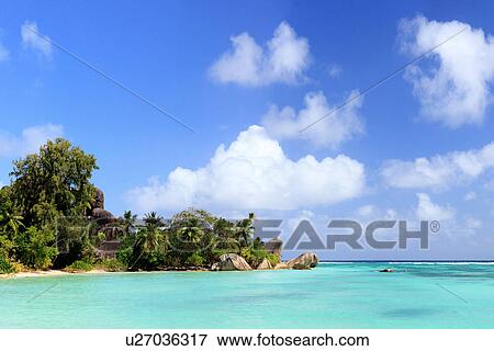 Stock Photo - Turquoise sea and trees, La Digue, Seychelles. Fotosearch