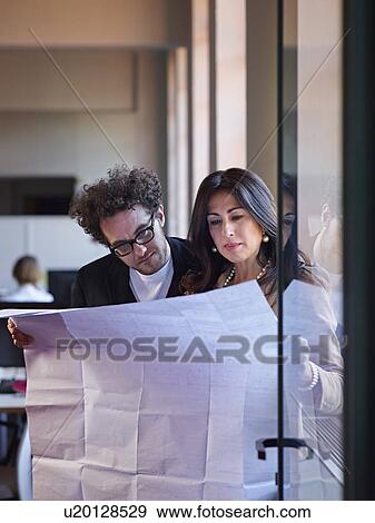 Stock Photo - Two architects with blueprints. Fotosearch