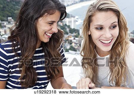 Two young women, Casa Alto Vidigal, Rio De Janeiro, Brazil View Large Photo Image Stock Photo - Two young women, Casa Alto Vidigal, Rio De Janeiro, Brazil. Fotosearch