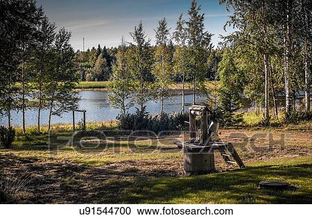 Stock Image - Water well in rural scenet, Lulea, Sweden. Fotosearch