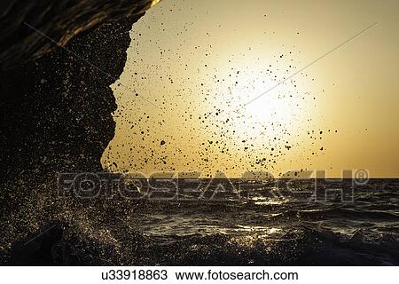 Stock Image - Waves at sunset at Seitani Bay, Samos, Greece. Fotosearch