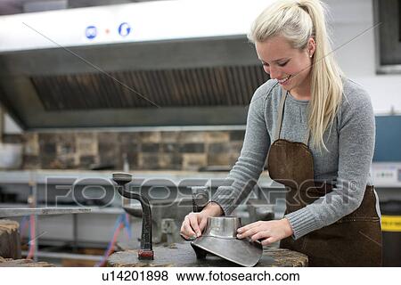 Woman metalworking in jewelry making studio View Large Photo Image Stock Photo - Woman metalworking in jewelry making studio. Fotosearch