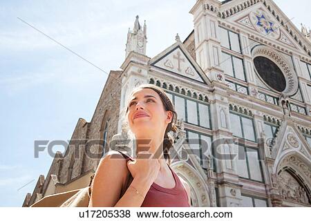 Stock Photo - Woman outside Santa Croce church, Piazza di Santa Croce, Florence, Tuscany, Italy. Fotosearch