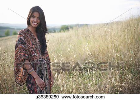 Stock Image - Woman posing for camera. Fotosearch