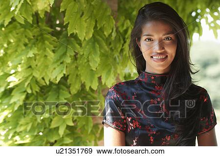 Woman posing for camera View Large Photo Image Stock Photo - Woman posing for camera. Fotosearch