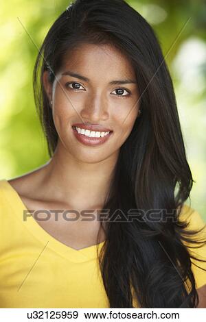Stock Photo - Woman posing for camera. Fotosearch