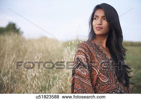 Woman posing for camera View Large Photo Image Stock Photo - Woman posing for camera. Fotosearch