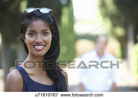 Woman posing for camera View Large Photo Image Stock Photo - Woman posing for camera. Fotosearch