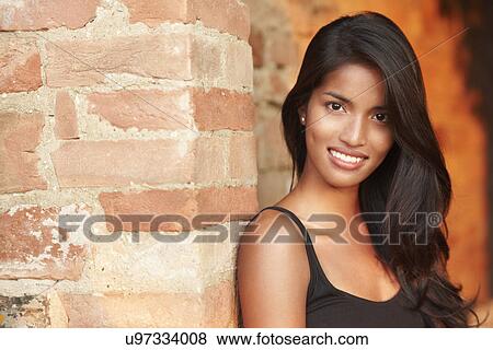 Stock Photo - Woman posing for camera. Fotosearch